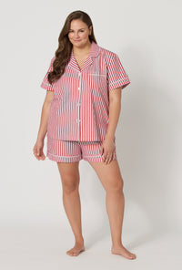 A lady wearing plus size Red Signature Stripe Short Sleeve Classic Woven Cotton Sateen Shorty Pj Set