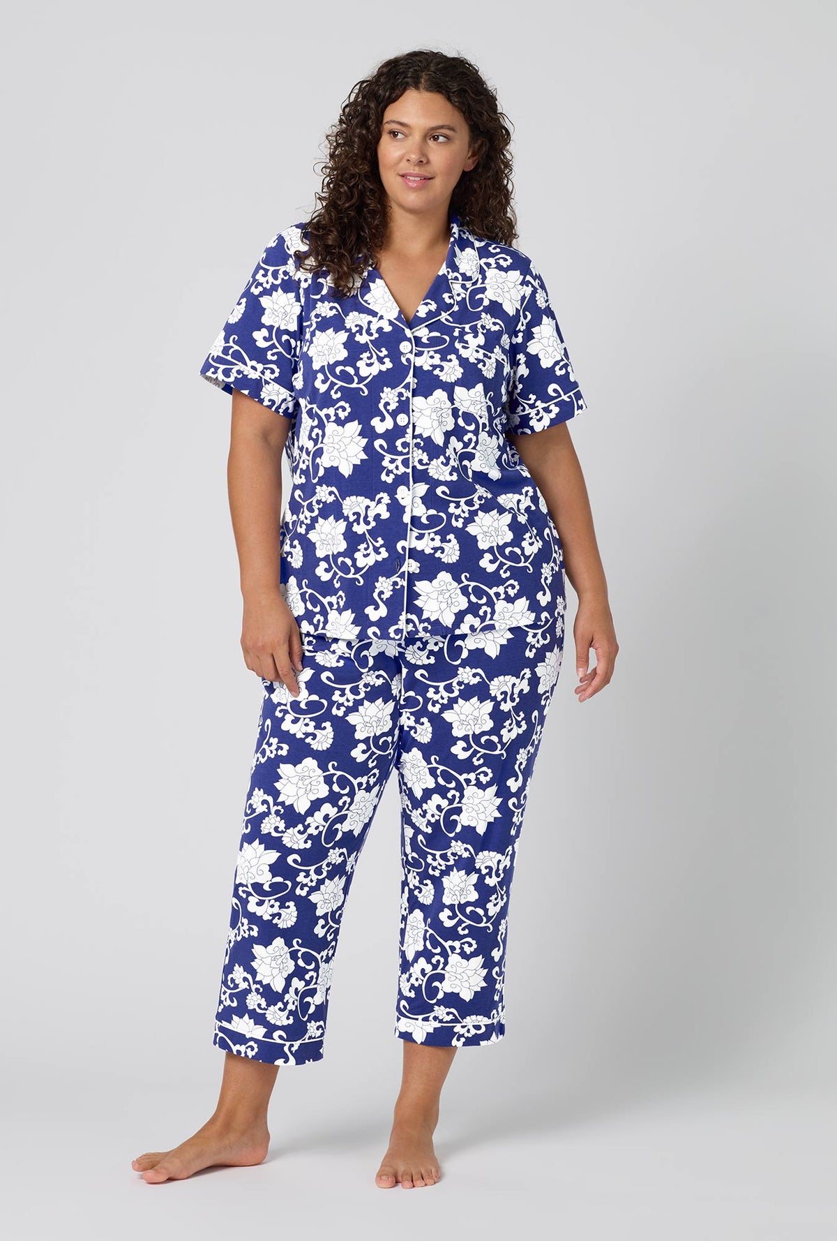 A Lady Wearing Plus Size Dynasty Blue Short Sleeve Classic Stretch Jersey Cropped Pj Set