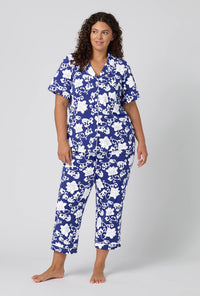 A Lady Wearing Plus Size Dynasty Blue Short Sleeve Classic Stretch Jersey Cropped Pj Set