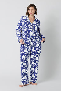 A Lady Wearing Plus Size Dynasty Blue Long Sleeve Classic Stretch Jersey Pj Set