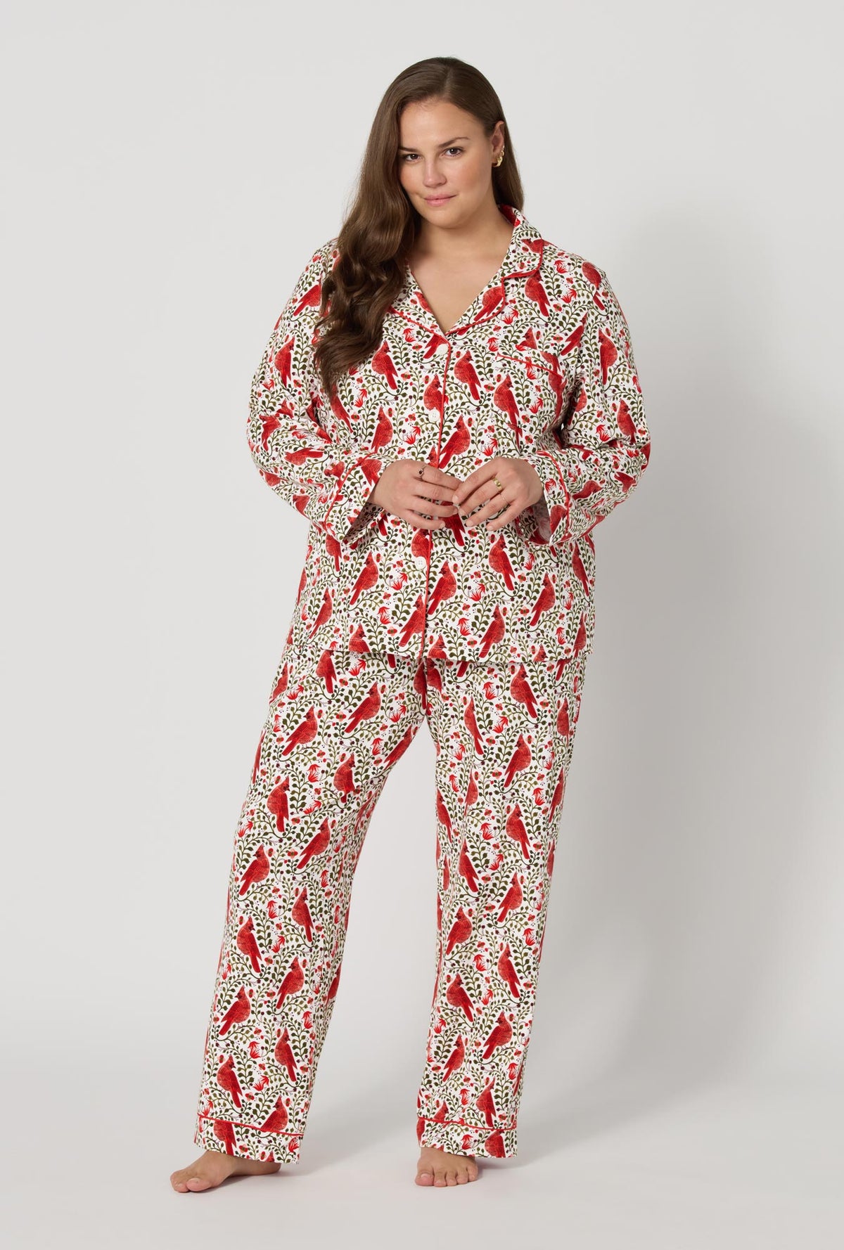 A lady wearing plus size Rifle Paper Co. x BedHead PJs Cardinals Long Sleeve Classic Stretch Jersey Pj Set