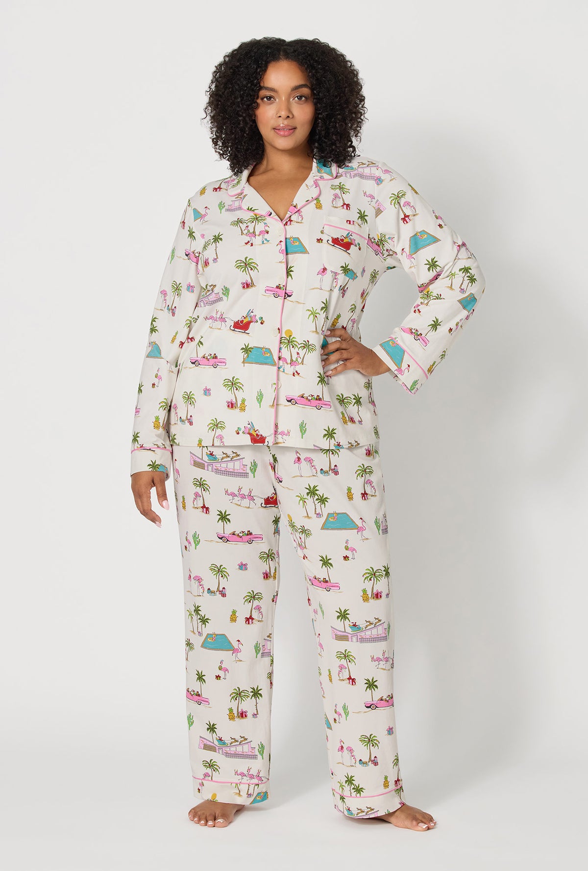 A lady wearing plus size Festive Flamingos Long Sleeve Classic Stretch Jersey Pj Set 