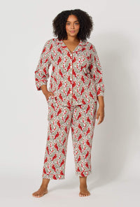A lady wearing plus size Rifle Paper Co. x BedHead PJs Cardinals 3/4 Sleeve Classic Stretch Jersey Cropped Pj Set