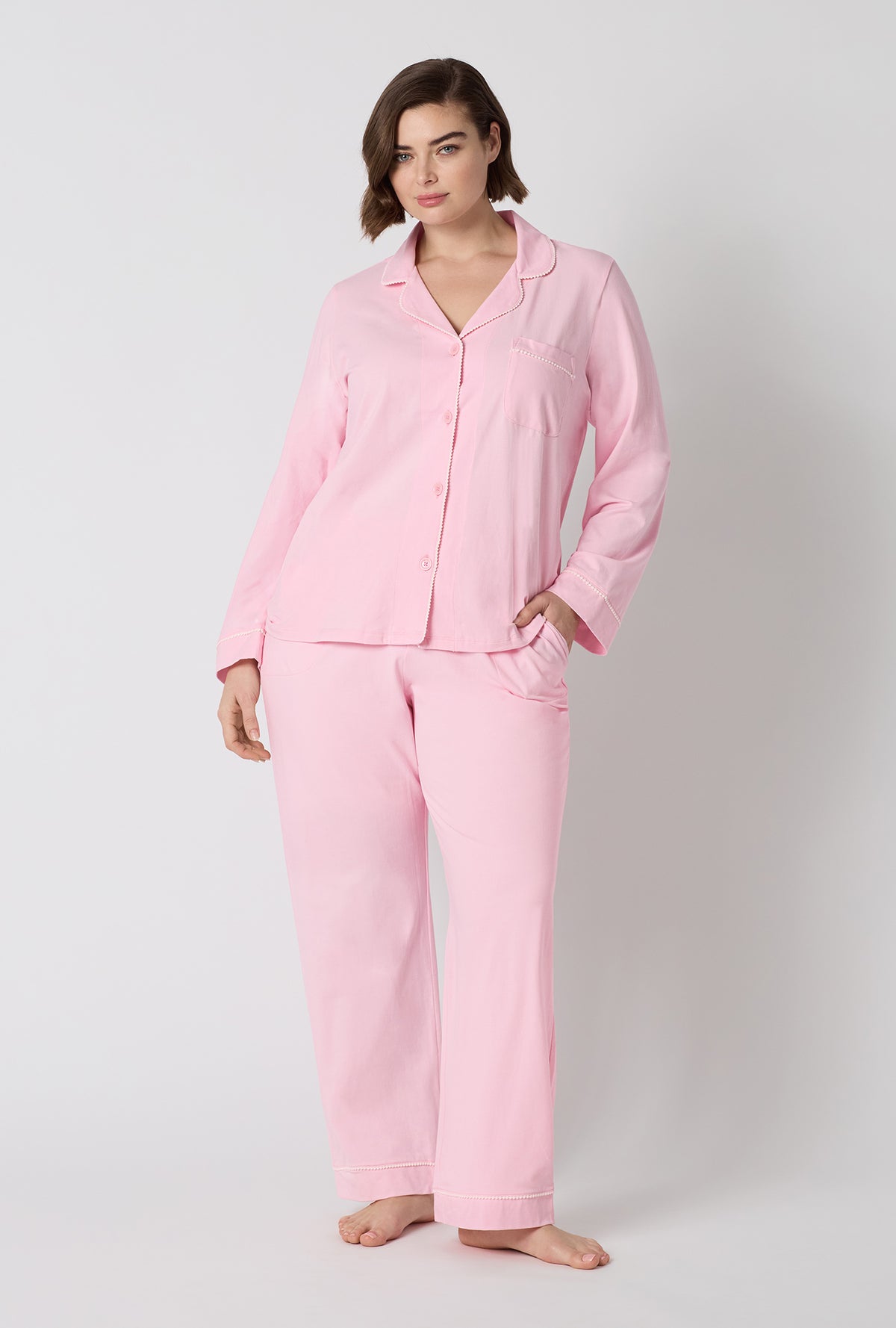 A lady wearing plus size Pink Powder Long Sleeve Classic Stretch Jersey Pj Set