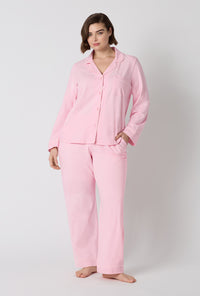A lady wearing plus size Pink Powder Long Sleeve Classic Stretch Jersey Pj Set