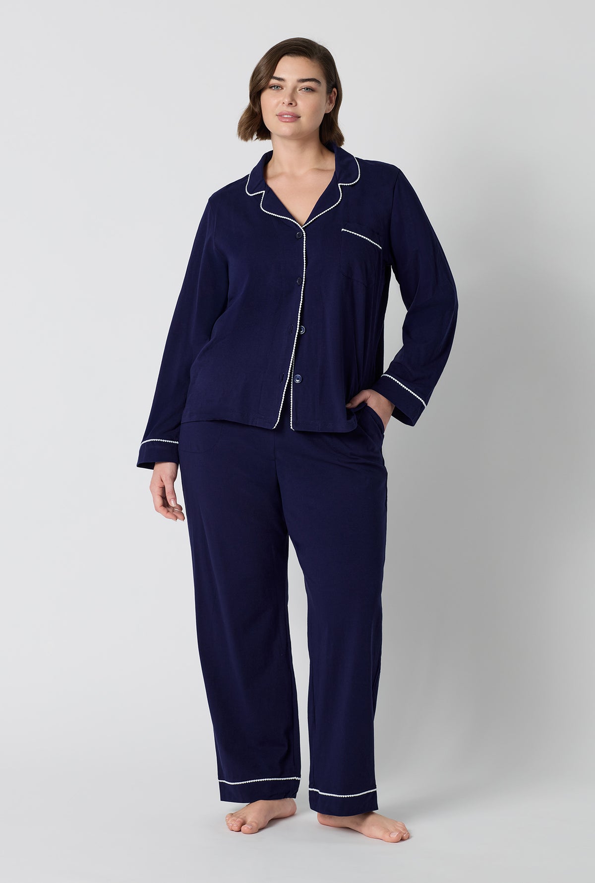 A lady wearing plus size Midnight Navy Long Sleeve Classic Stretch Jersey Pj Set