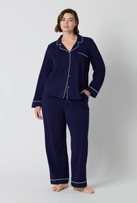 A lady wearing plus size Midnight Navy Long Sleeve Classic Stretch Jersey Pj Set