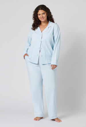 A lady wearing plus size Blissful Blue Long Sleeve Classic Stretch Jersey Pj Set 