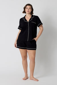A lady wearing plus size Black Beauty Short Sleeve Classic Shorty Stretch Jersey Pj Set 