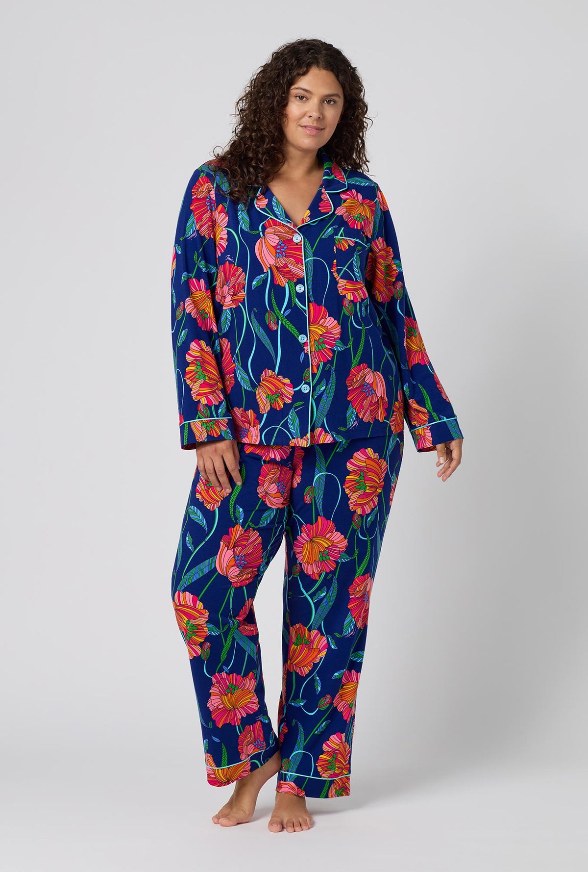 A Lady Wearing Plus Size BedHead x Trina Turk Linear Poppy Long Sleeve Classic Stretch Jersey Pj Set