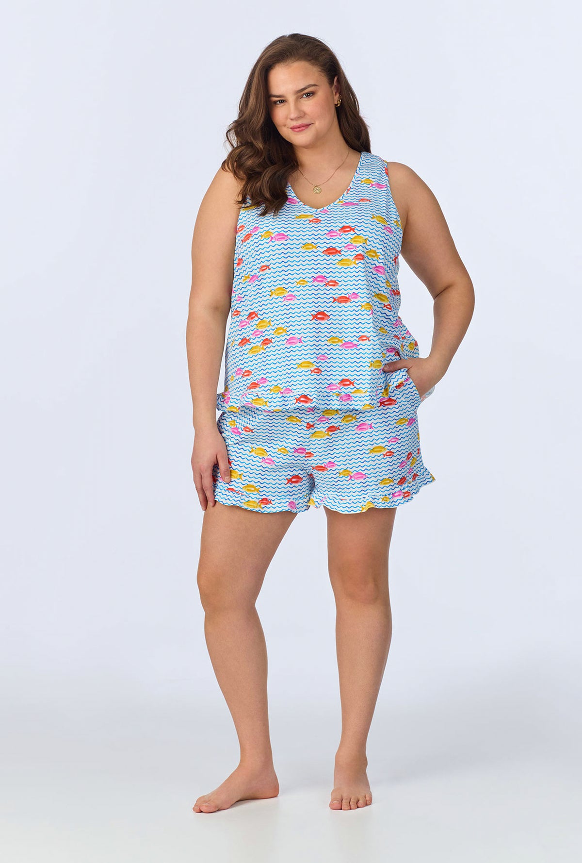 A lady wearing Marina Grande Ruffle Tank Stretch Jersey Shorty PJ Set