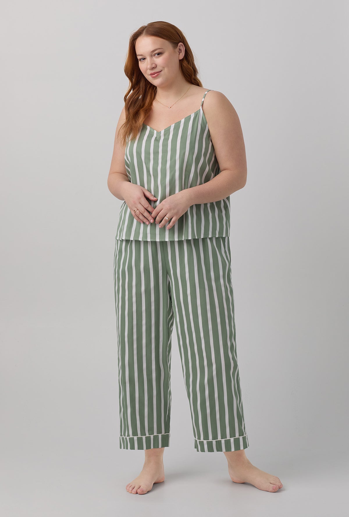 A lady wearing plus size green Woven Cotton Sateen Cropped PJ Set with North Shore Stripe print.