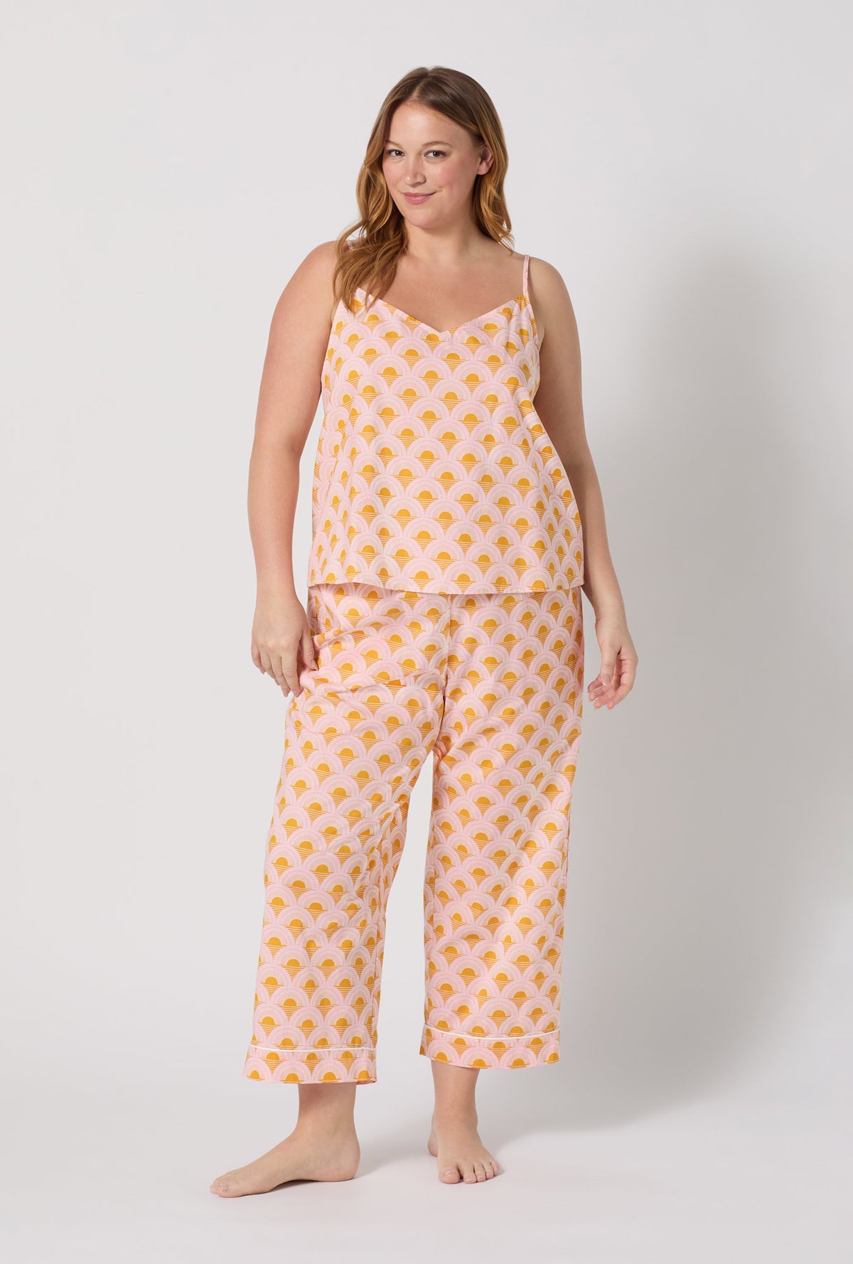 A Lady Wearing Plus Size Deco Sunset Cami Woven Cotton Poplin Cropped Pj Set facing front in a standing pose