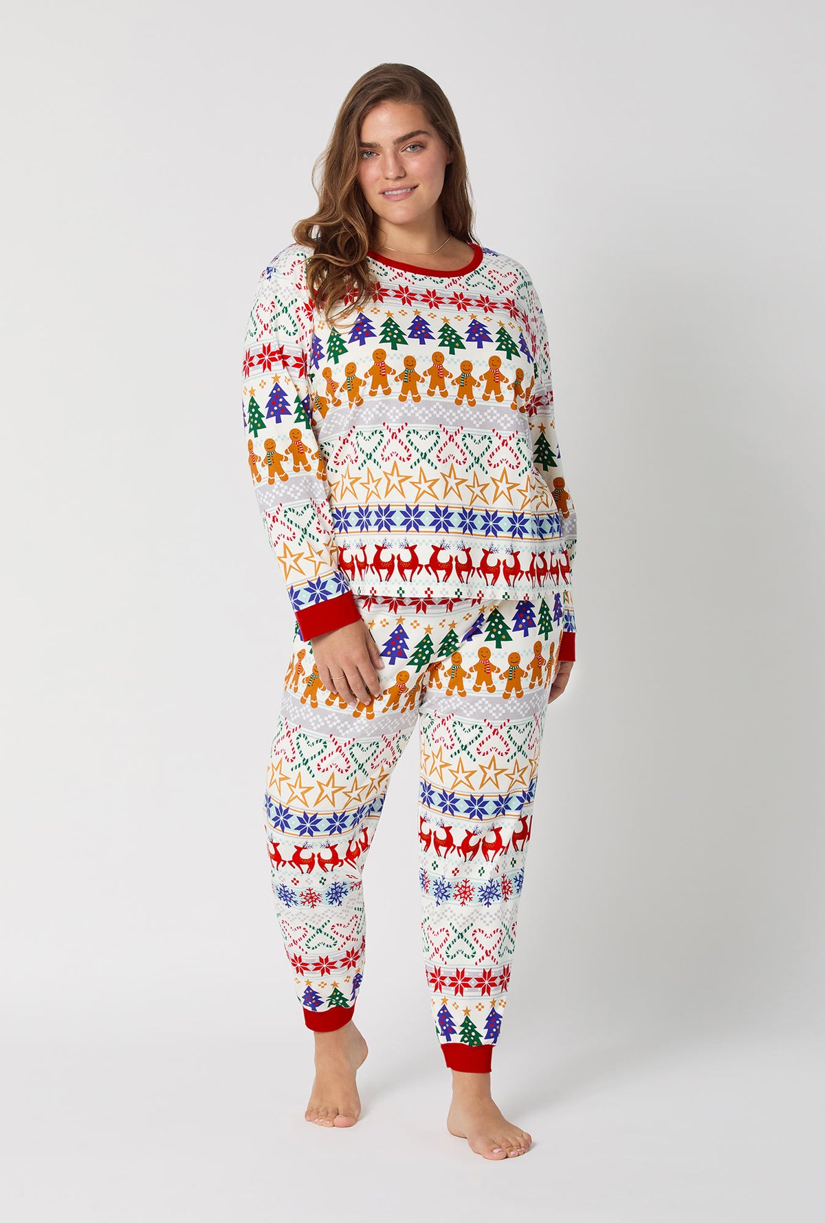 A lady wearing Deck The Halls Long Sleeve Pullover Crew And Jogger Stretch Jersey Pj Set
