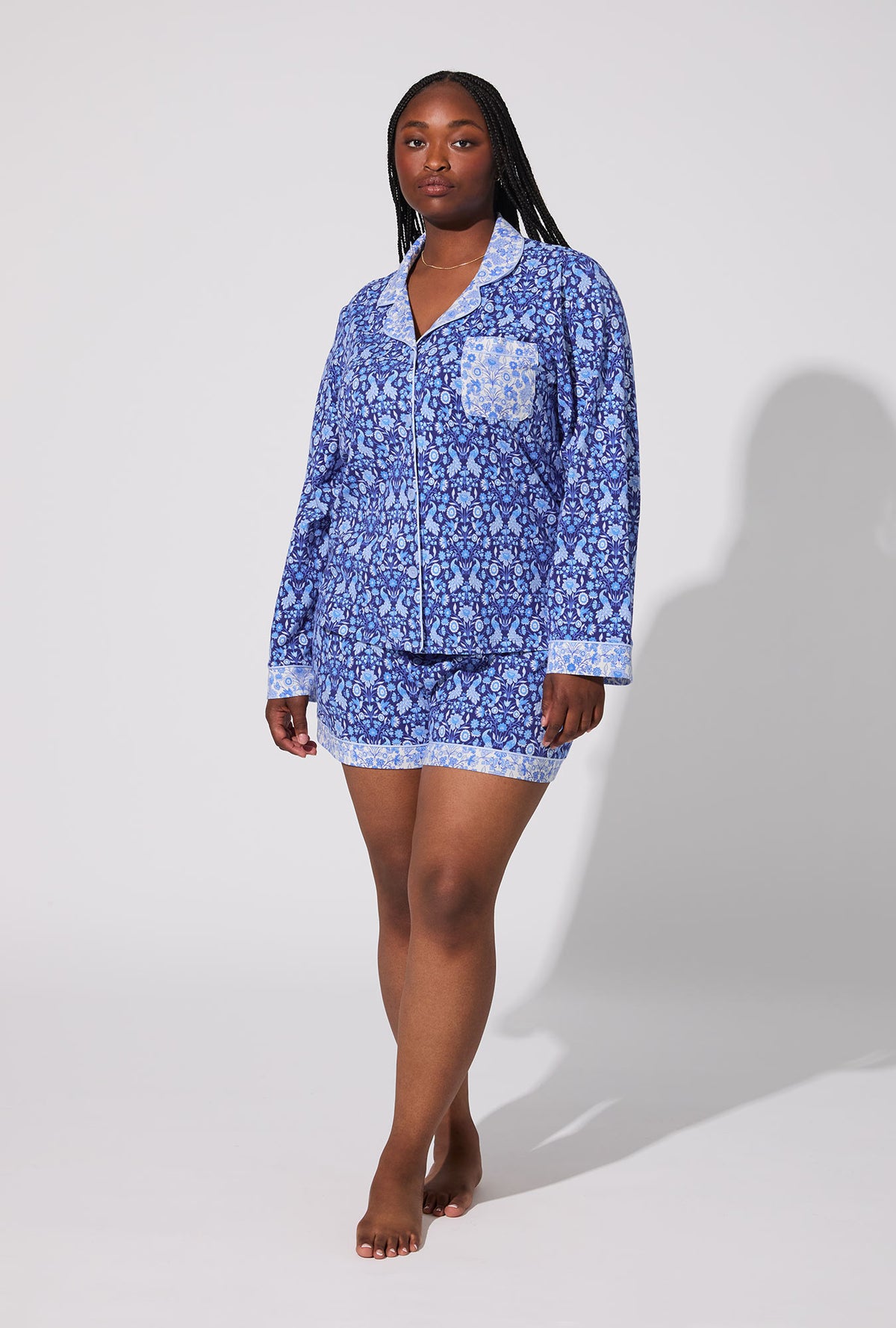 A lady wearing Bloomscape Blue Long Sleeve Classic Stretch Jersey Shorty PJ Set