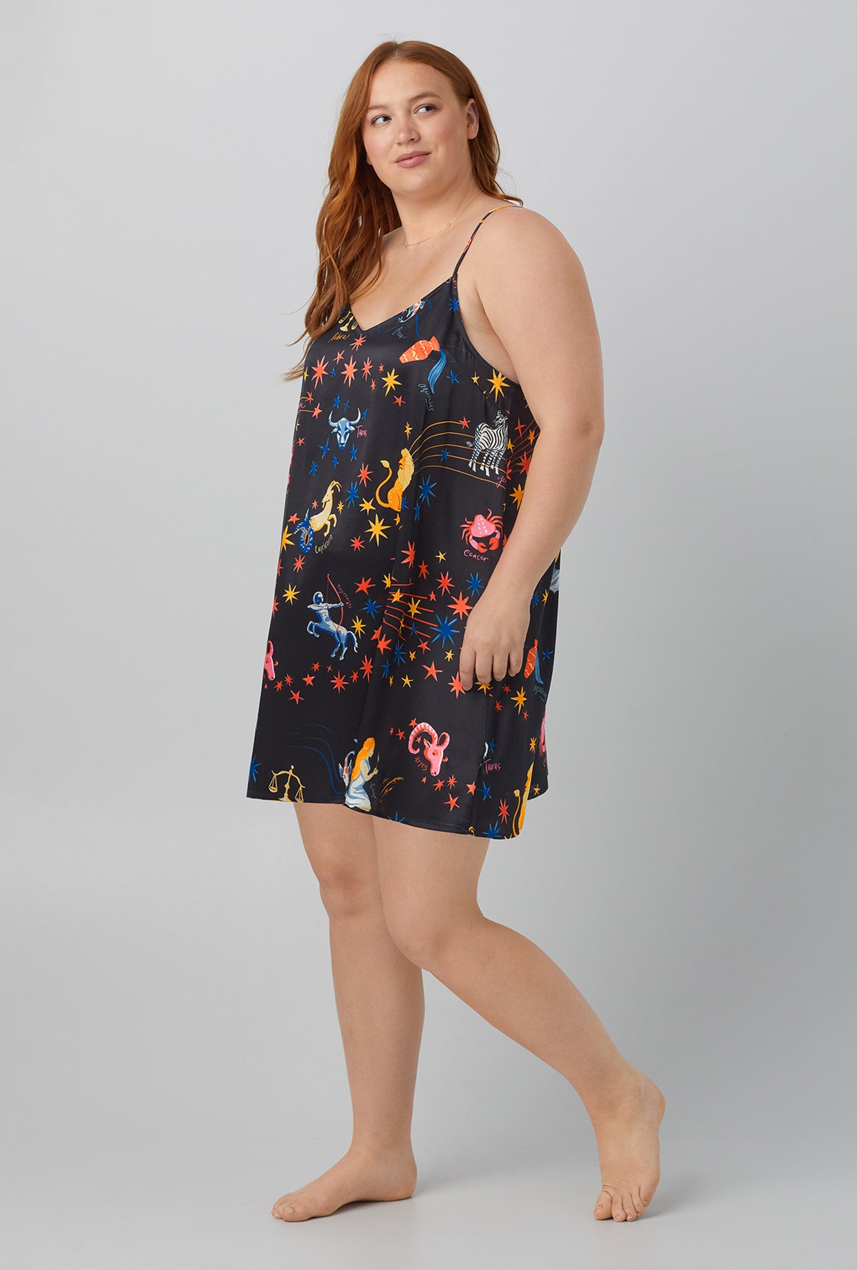 A lady wearing black  Washable Silk Satin Chemise with Celestial Dreams print