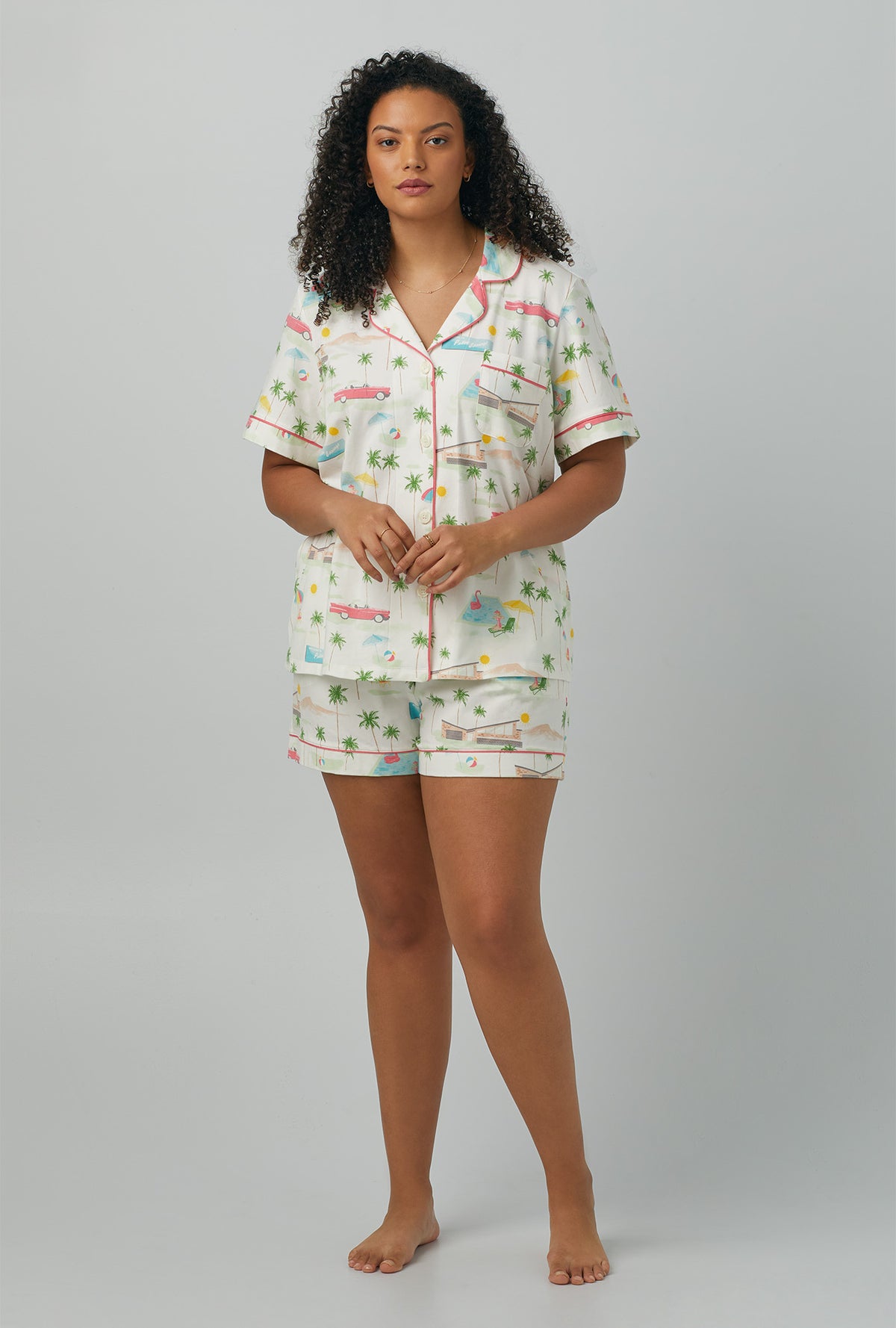A lady wearing plus size  white Short Sleeve Classic Shorty Stretch Jersey PJ Set with Welcome To Palm Springs print