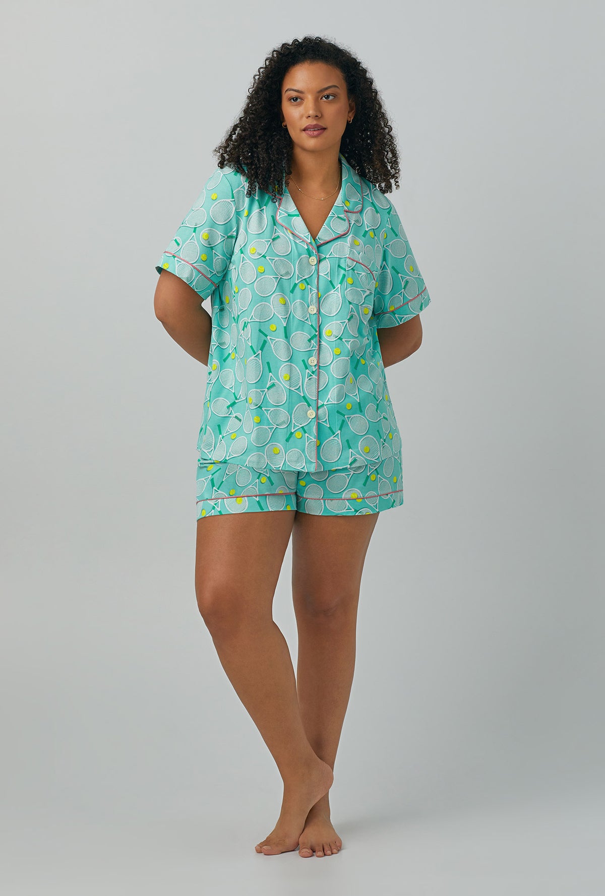 A lady wearing plus size green Short Sleeve Classic Shorty Stretch Jersey PJ Set with Tennis Club print