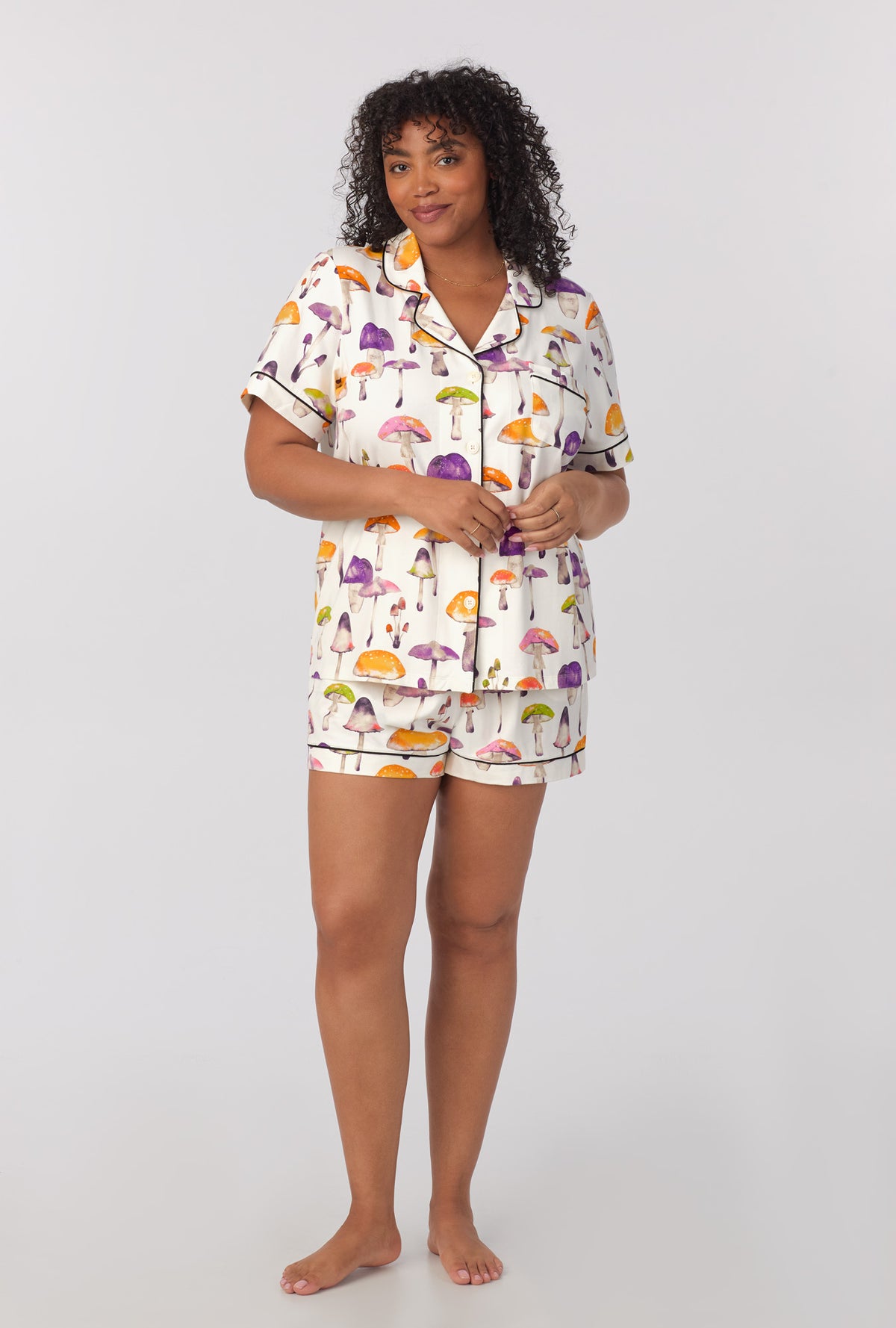 A lady wearing plus size Short Sleeve Classic Shorty Stretch Jersey PJ Set with Dazzling Mushrooms print 