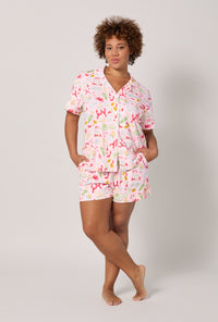A lady wearing plus size French Quarter Short Sleeve Classic Shorty Stretch Jersey Pj Set