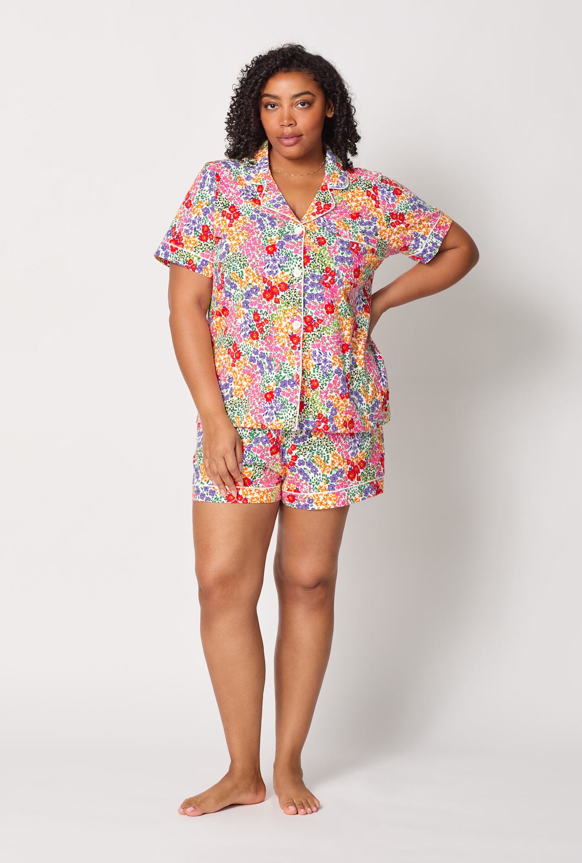 A lady wearing plus size Spring Fields Short Sleeve Classic Shorty Stretch Jersey Pj Set