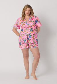 A lady wearing plus size Pink Short Sleeve Classic Woven Cotton Poplin Shorty Pj Set front view