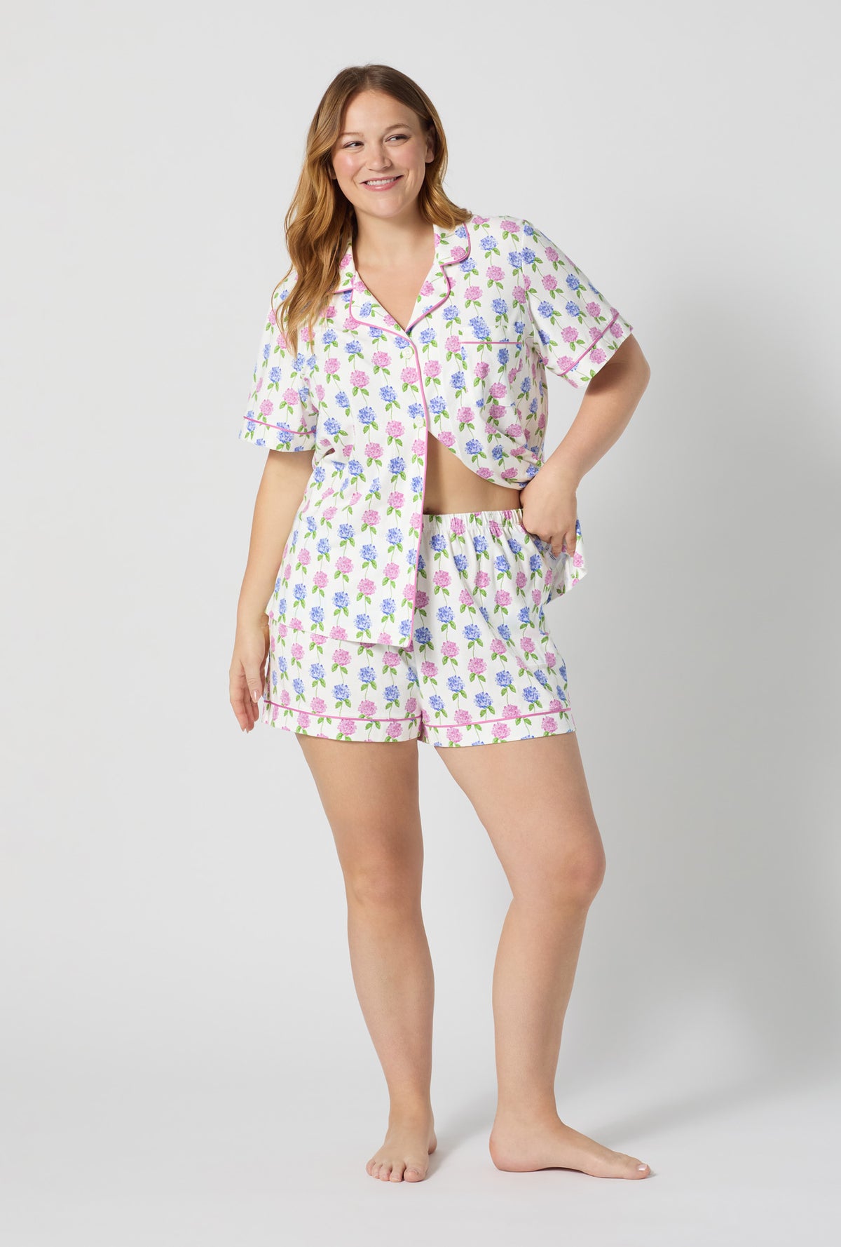 A lady wearing plus size Cottage Parlor Short Sleeve Classic Shorty Stretch Jersey Pj Set back view