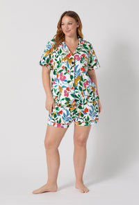 A Lady Wearing Plus Size Jungle Serenade Short Sleeve Classic Shorty Stretch Jersey Pj Set posing with a front view look
