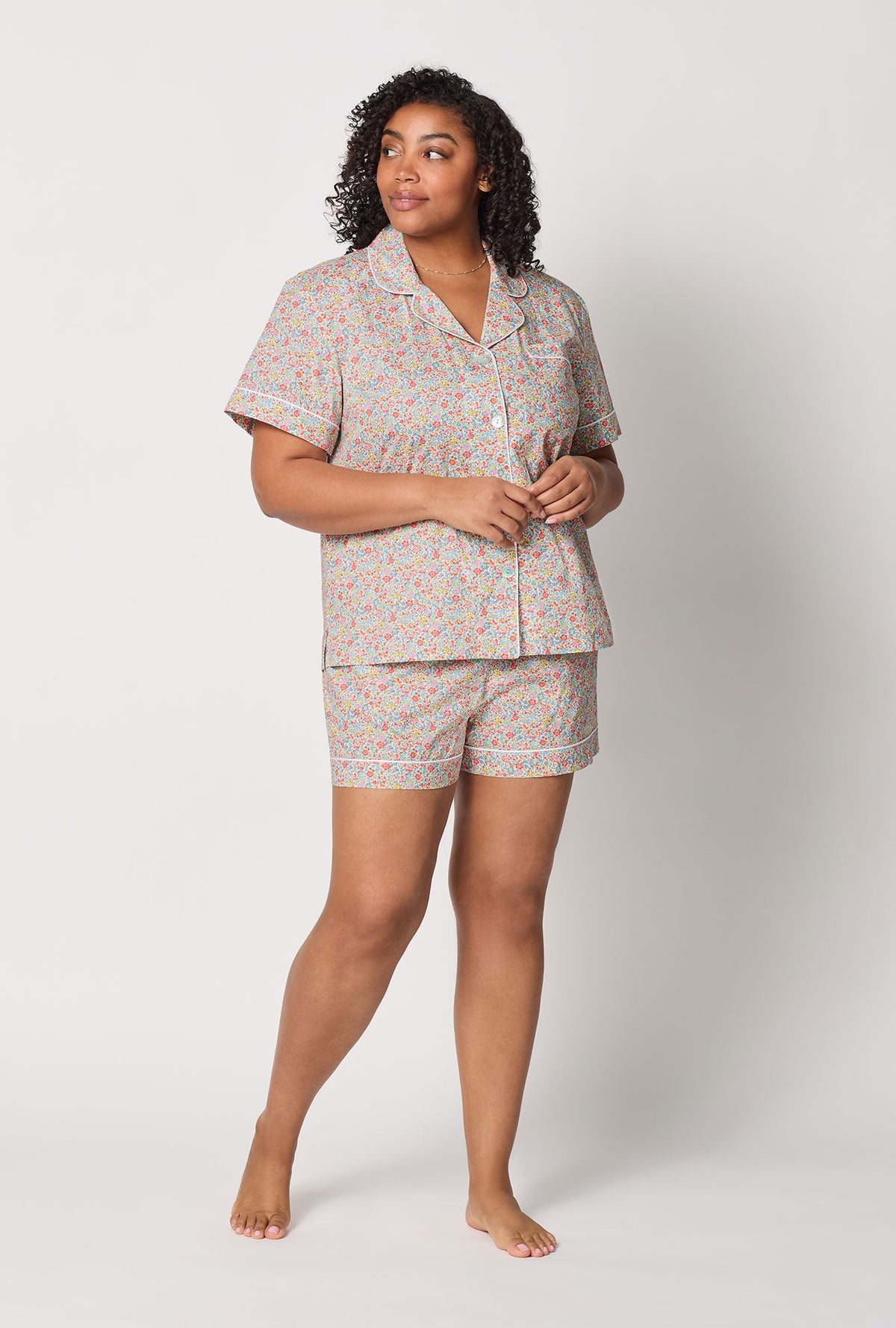 A lady wearing plus size Emma & Georgina Short Sleeve Classic Shorty Woven Tana Lawn® PJ Set Made with Liberty Fabric front view