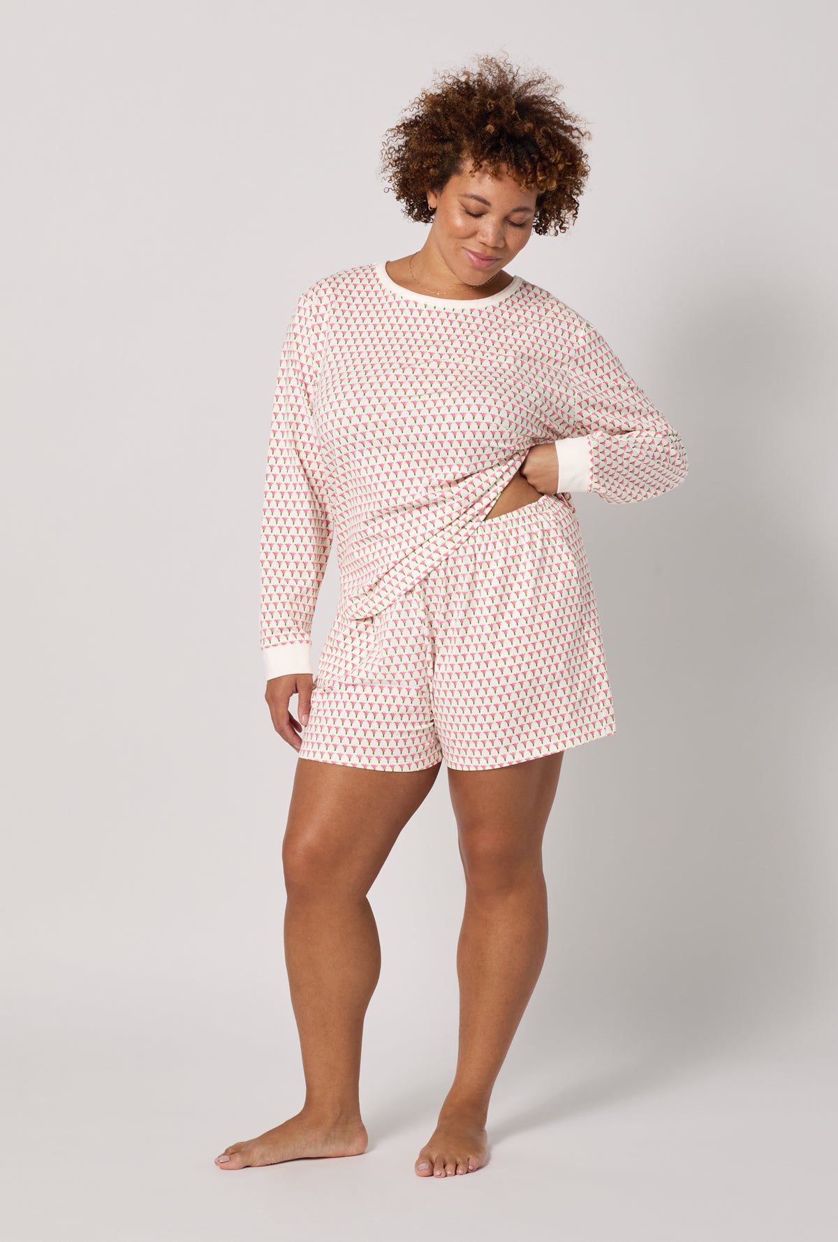 A lady wearing plus Blossom Geo Long Sleeve Pullover Crew And Shorty Stretch Jersey Pj Set