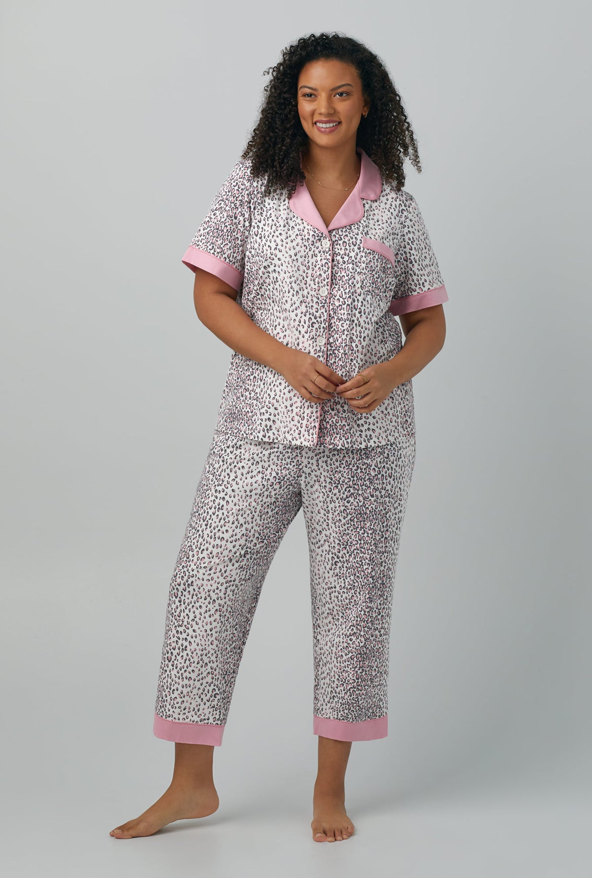 A lady wearing Short Sleeve Classic Stretch Jersey Cropped PJ Set with spa kitten print