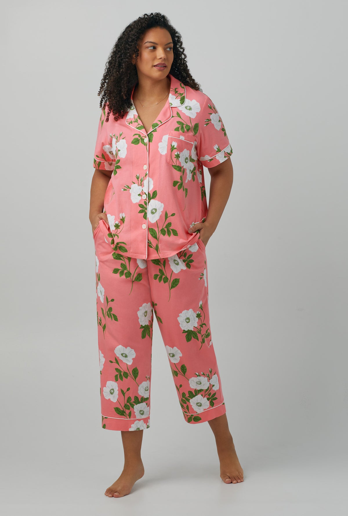 A lady wearing plus size red Short Sleeve Classic Stretch Jersey Cropped PJ Set with White Poppy print