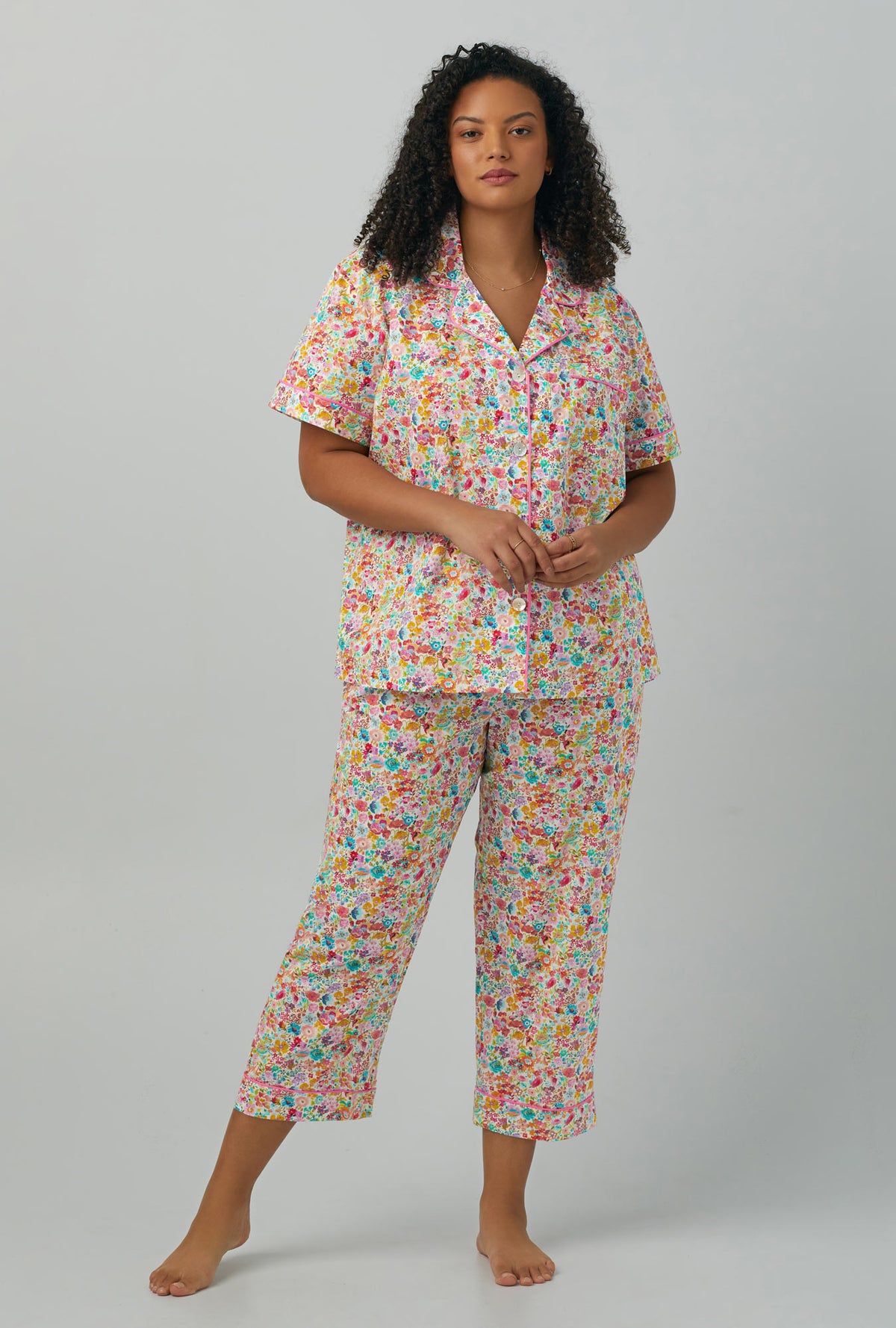 A lady wearing  multi color plus size  short Sleeve Classic Woven Cotton PJ Set with Classic Meadow print