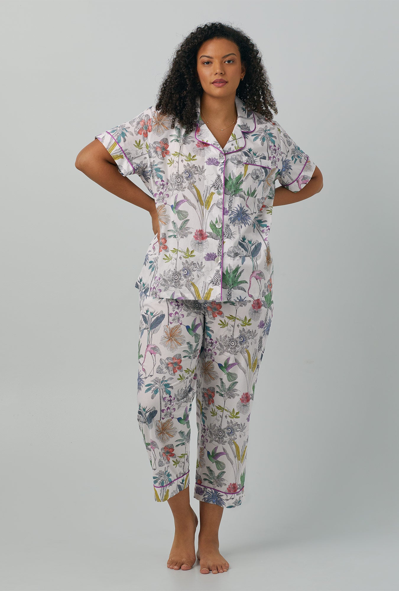 A lady wearing multi color Short Sleeve Classic Woven Cotton Cropped PJ Set with Darwin's Journey print