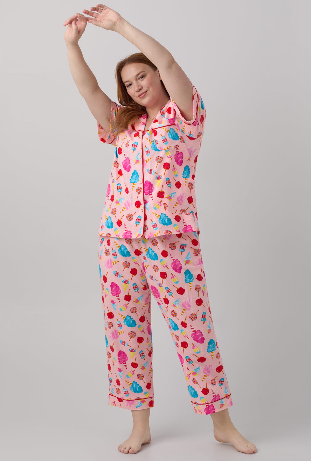 A lady wearing Short Sleeve Classic Stretch Jersey Cropped PJ Set with sweet treats print