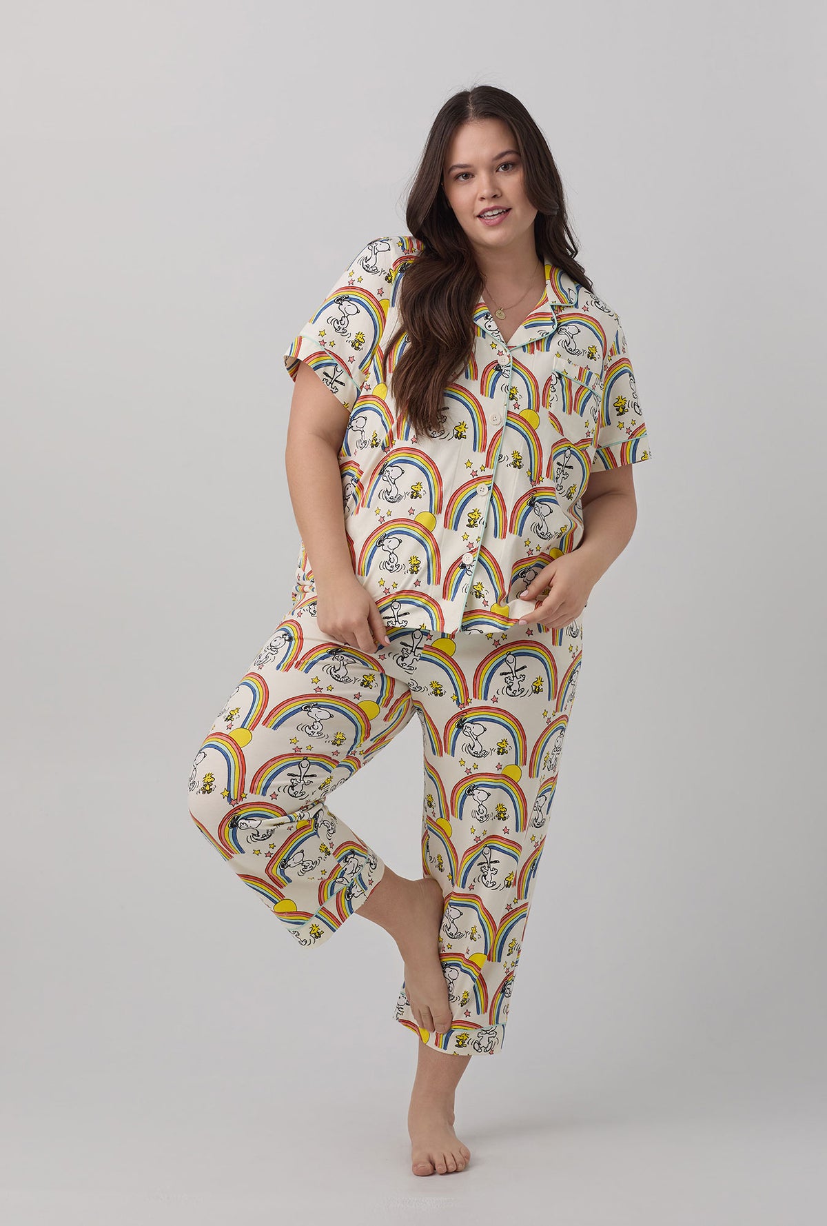 A lady wearing  plus size white Short Sleeve Classic Stretch Jersey Cropped PJ Set  with Sunshine Snoopy print.