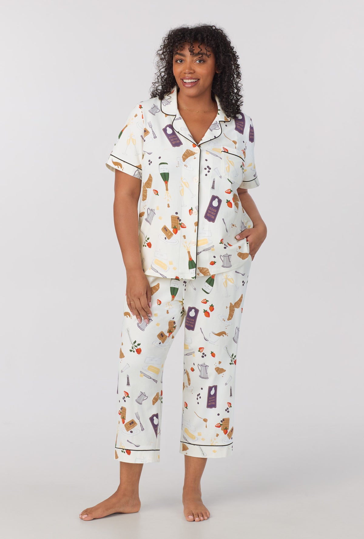 A lady wearing Short Sleeve Classic Stretch Jersey Cropped PJ Set with Breakfast In Bed print