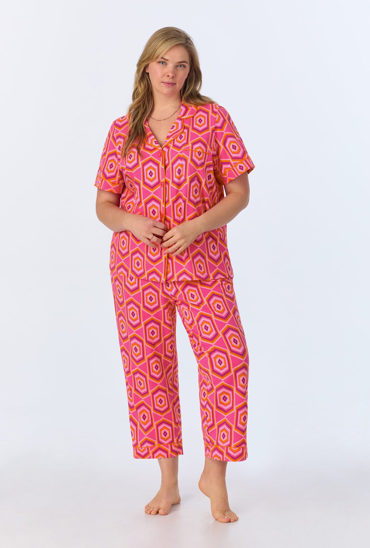 A lady wearing BedHead x Trina Turk Multi Hexagon Short Sleeve Classic Stretch Jersey Cropped PJ Set
