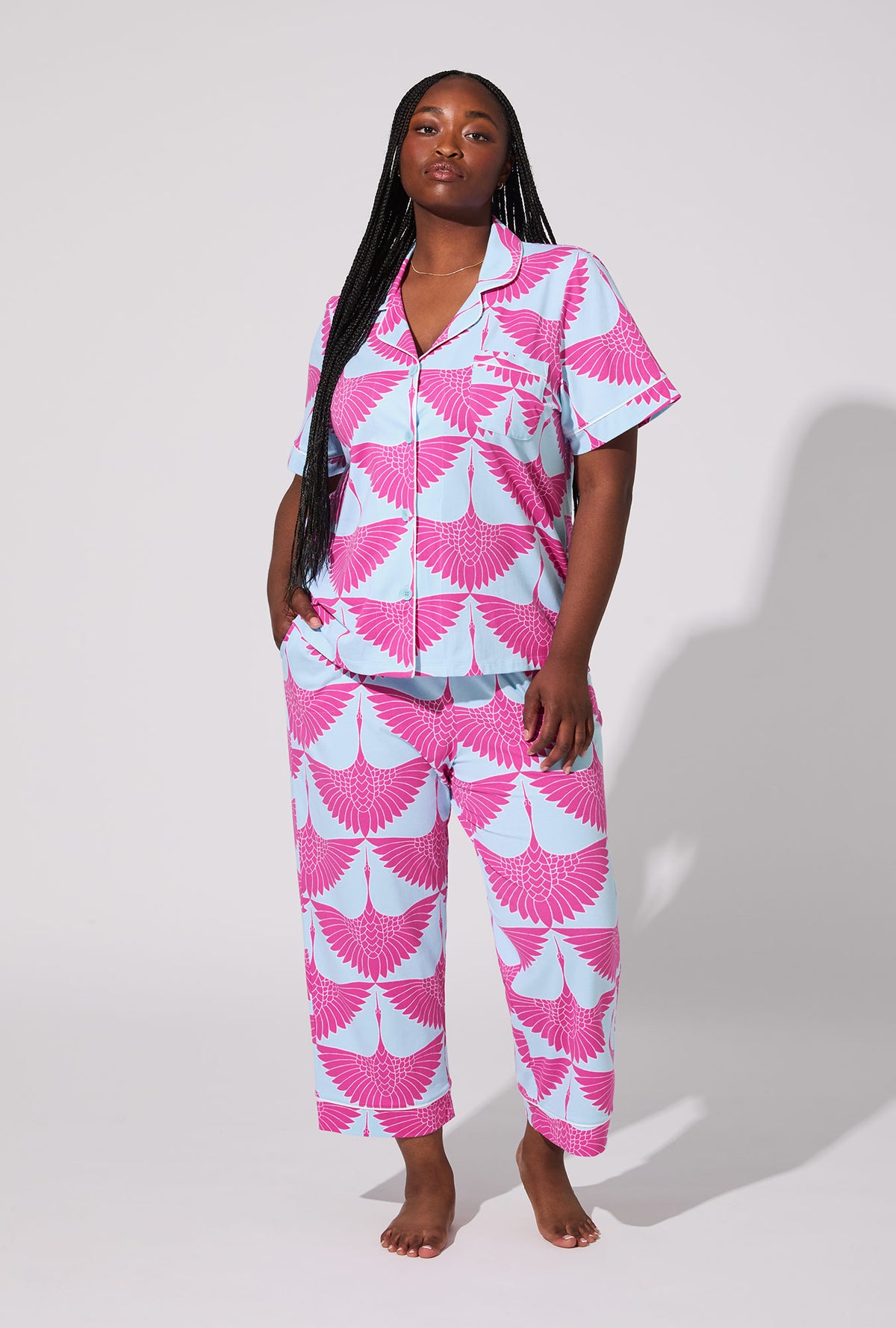 A lady wearing BedHead X Trina Turk Cranes Short Sleeve Classic Stretch Jersey Cropped PJ Set