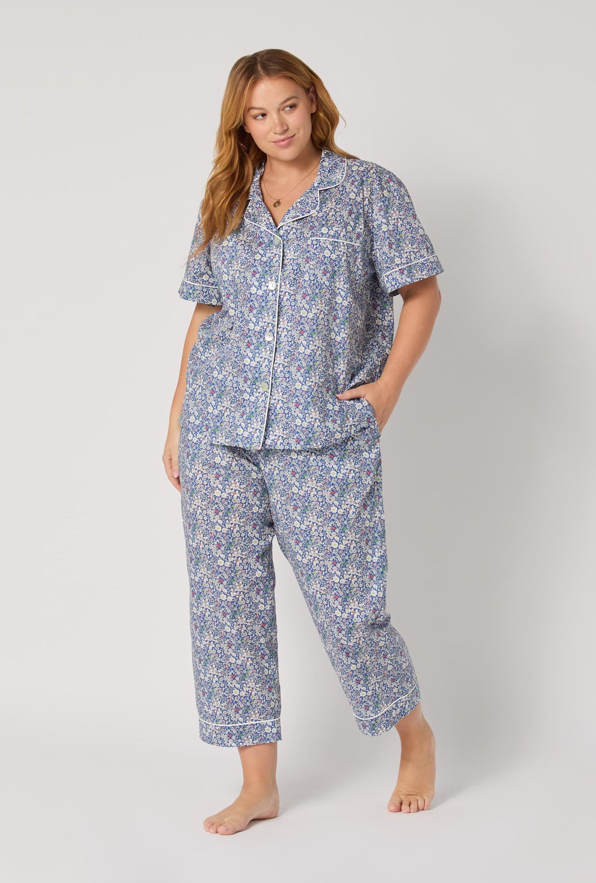 A Lady wearing June's Meadow Short Sleeve Classic Woven Tana Lawn® Cropped Pj Set Made With Liberty Fabric