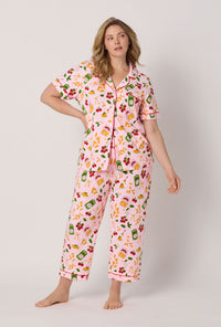 A lady wearing plus size Pink Short Sleeve Classic Stretch Jersey Cropped Pj Set front view