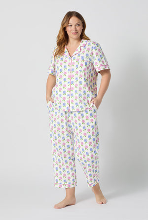 A lady wearing plus size Cottage Parlor Short Sleeve Classic Stretch Jersey Cropped Pj Set