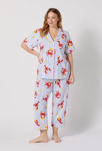 A lady wearing plus size Coastal Feast Short Sleeve Classic Stretch Jersey Cropped Pj Set 