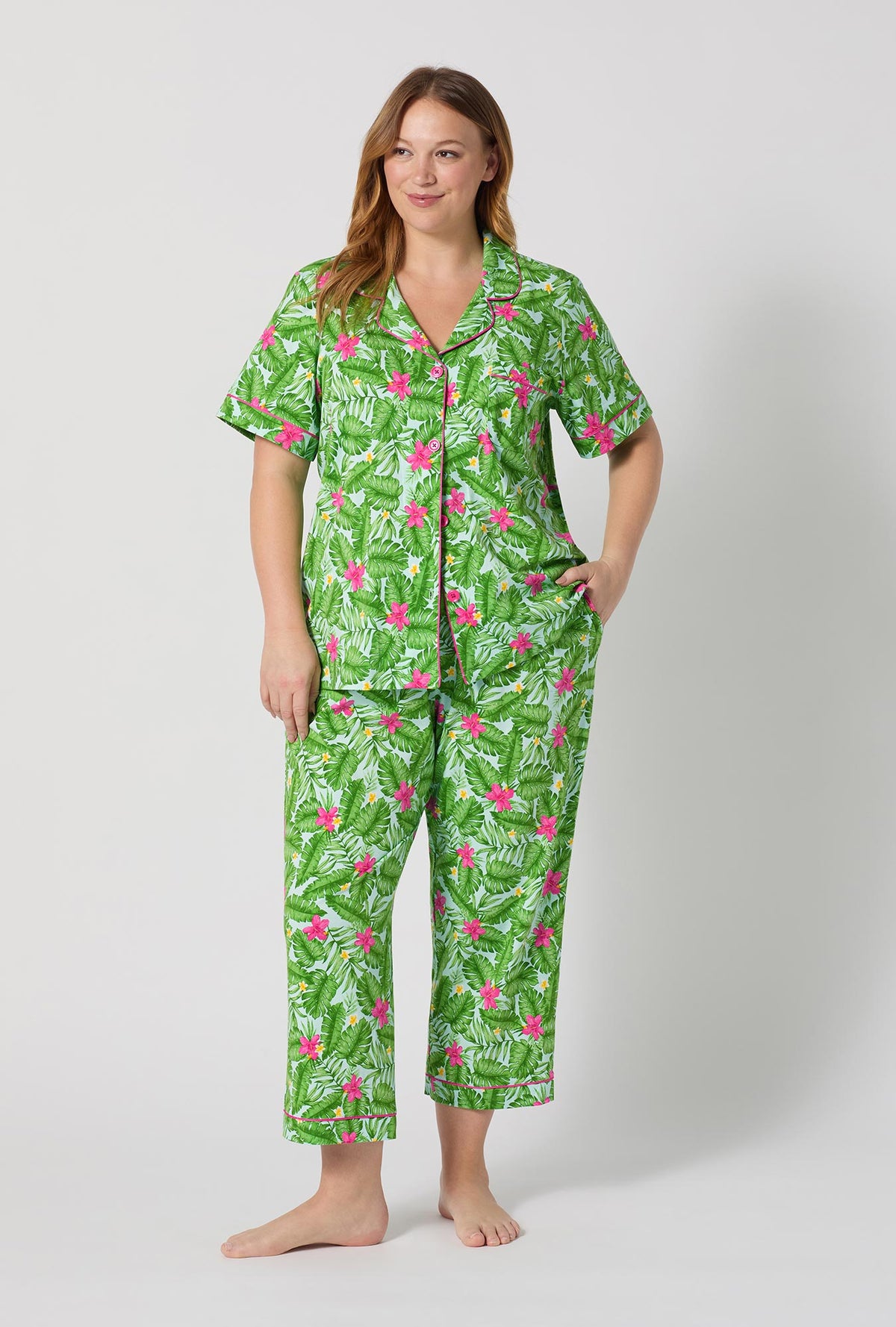 A Lady Wearing Plus Size Monstera Bloom Short Sleeve Classic Stretch Jersey Cropped Pj Set posing with a front view
