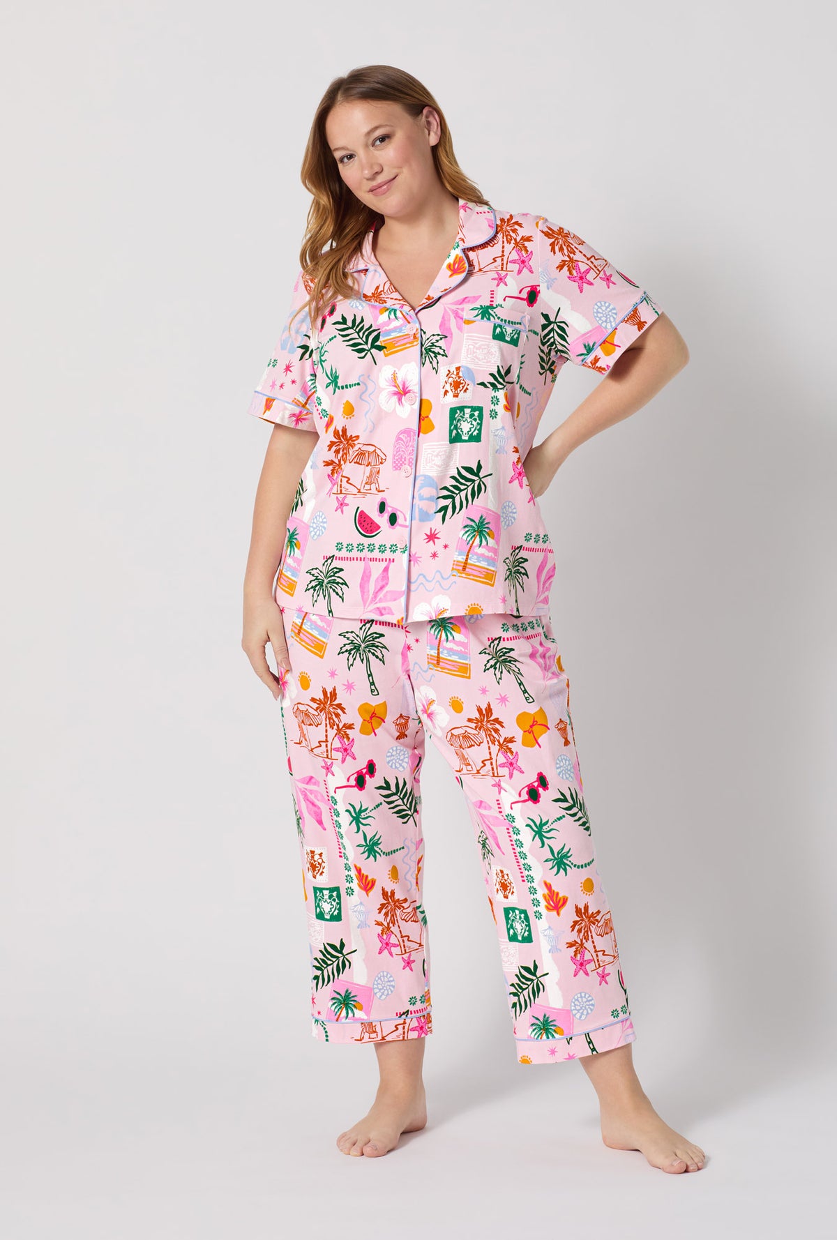 A Lady Wearing Plus Size Tropical Daydream Short Sleeve Classic Stretch Jersey Cropped Pj Set posing with a front view look
