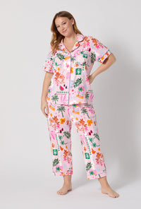 A Lady Wearing Plus Size Tropical Daydream Short Sleeve Classic Stretch Jersey Cropped Pj Set posing with a front view look