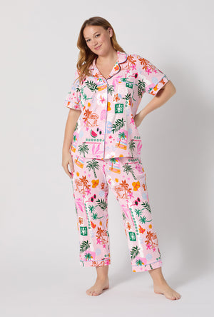 A Lady Wearing Plus Size Tropical Daydream Short Sleeve Classic Stretch Jersey Cropped Pj Set posing with a front view look
