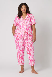 A Lady Wearing Plus Size Cake Shop Short Sleeve Classic Stretch Jersey Cropped Pj Set in a front view pose
