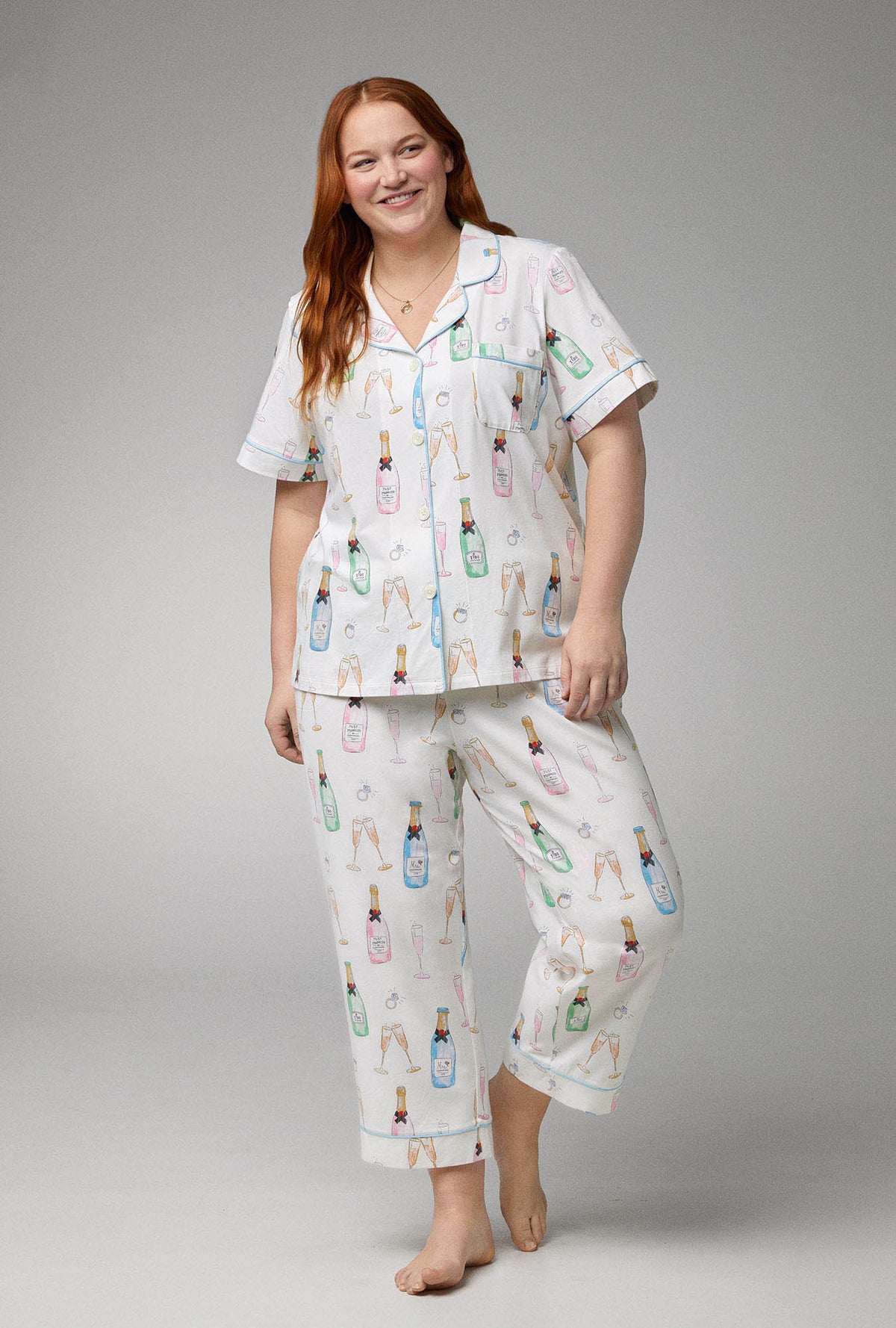 A lady wearing Short Sleeve Classic Stretch Jersey Cropped plus size PJ Set with Champagne Wedding print