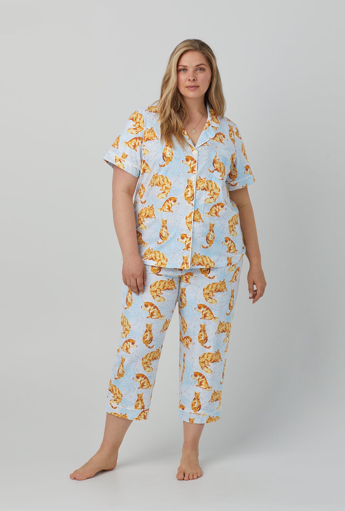 A lady wearing short sleeve classic stretch jersey cropped pj set with fancy cats print